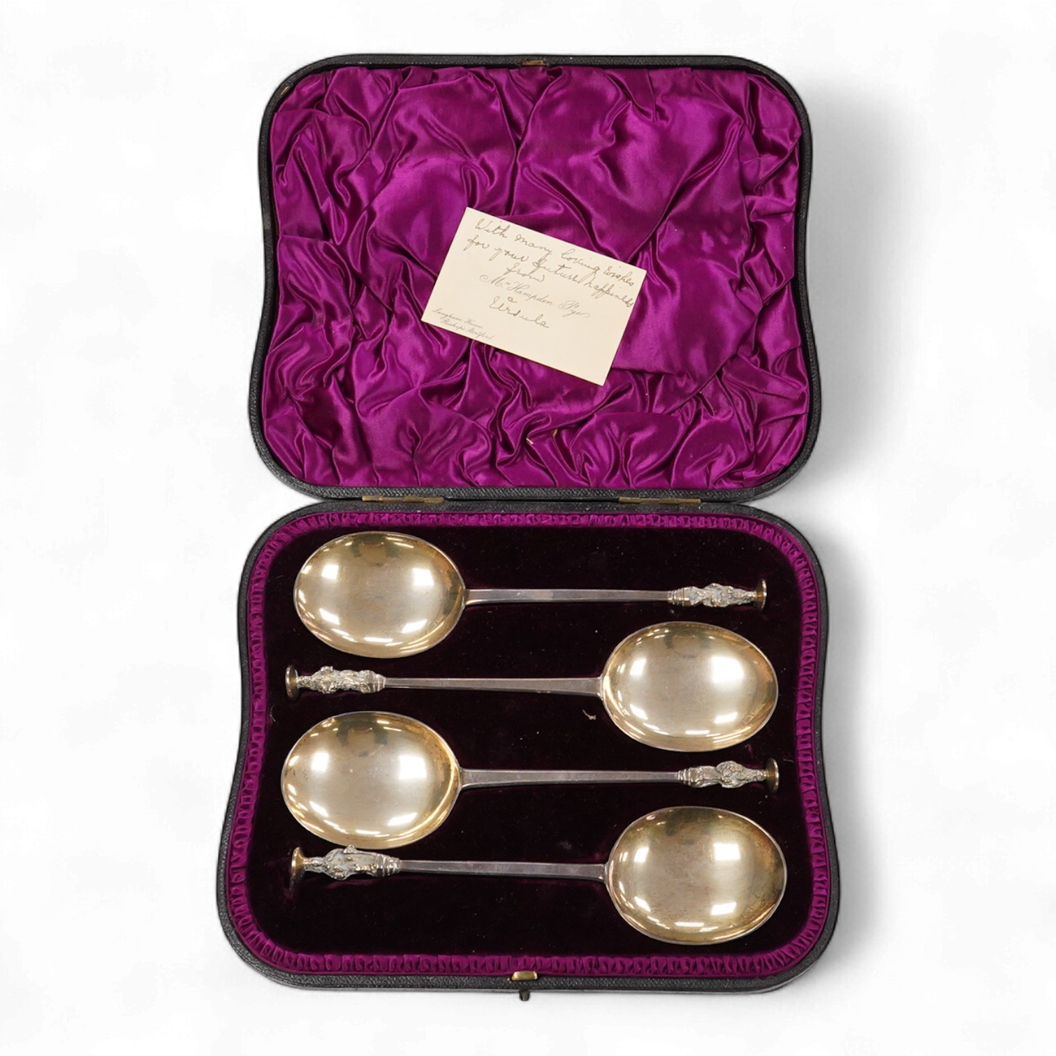 A late Victorian cased set of four silver apostle serving spoons, by Wakely & Wheeler, London, 1890, 19.6cm, 6.5oz.
